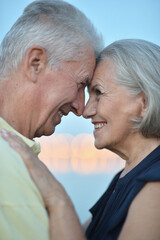 Happy senior couple embracing outdoors