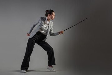 A businesswoman in a business casual suit attacks competitors,
