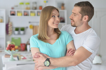 Close up portrait of happy young couple having fun  at home