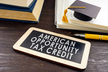 American Opportunity Tax Credit AOTC on the plate and graduation cap.