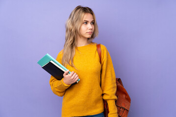 Teenager Russian student girl isolated on purple background portrait