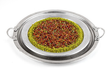 Turkish dessert kunefe, kunafa, kadayif with pistachio powder and cheese, served hot, very sweet. Turkish traditional dessert isolated top view