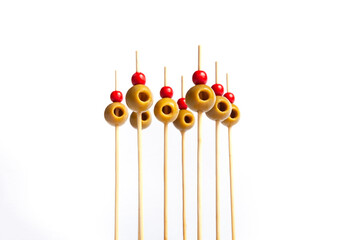 Isolated olives on skewers with white background