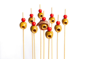 Isolated olives on skewers with white background