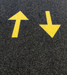 yellow arrow on asphalt