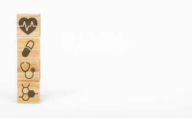 Wooden blocks with the healthcare medical symbol.
