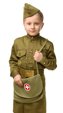 A little girl with a long pigtail and a white bow in a Soviet military nurse's uniform. Concept for the Victory Day in World War II on May 9