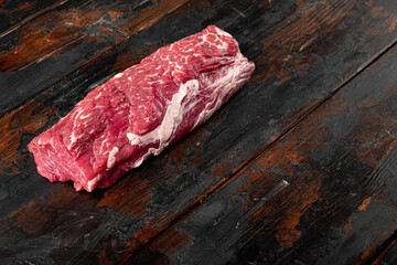 Fresh and raw fillet meat. Whole piece of beef tenderloin steaks, on old dark  wooden table...