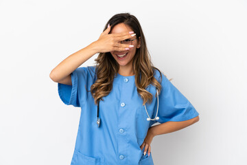 Young surgeon doctor woman over isolated white wall covering eyes by hands and smiling