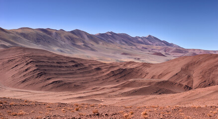 Fototapeta na wymiar panoramic view of the desolate mountain landscape in the vicinity of Tolar Grande on the high altitude puna in northwest Argentina