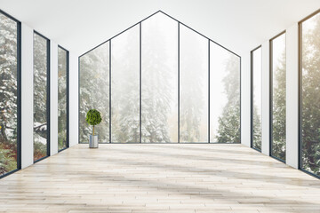 Empty sunny eco style room in the house outside the city with trees view from huge windows, wooden floor and small tree in a flowerpot