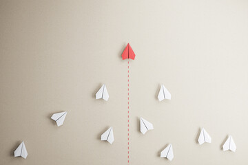 Success goal and creative idea concept with red paper plane compete with white paper planes on...