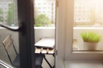 Cozy work place at balcony with nice decoration. Remote working place at home.