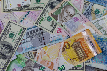 Obraz na płótnie Canvas Multicurrency background of US dollars, euros, Turkish liras, Egyptian pounds and Ukrainian hryvnias