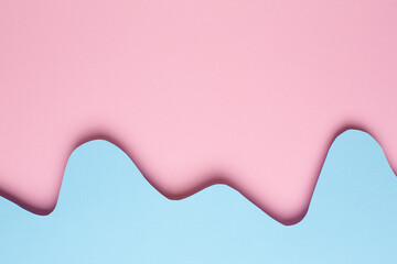 Different layers of abstract paper pink and blue waves on pastel background with copyspace