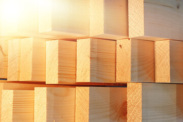 New planed wooden planks close-up. Advertising photo of construction materials. Background