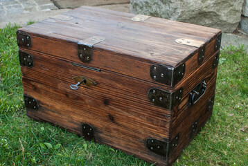 Old retro vintage wooden chest on house garden closeup