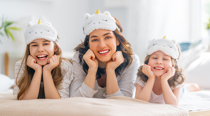 girls and their mother enjoying sunny morning