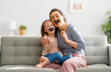 Fototapeta premium Mom and her daughter are playing