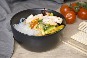 Funchoza with shrimps. Bowl with funchose and shrimps. Cooking. Food.