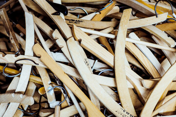 close up of stack of wooden clothe hanger