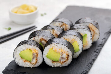 Sushi roll with nori, avocado, eel fish. Sushi menu. Japanese food.
