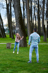 Couple playing badminton in the park