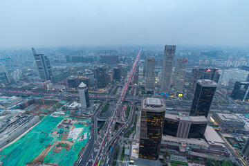 Obraz premium Aerial view of the city skyline of China World Trade Center in Beijing at dusk in a cloudy day