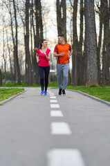 Young couple running in the park