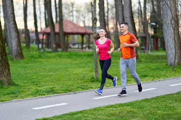 Young couple running in the park