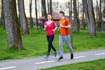 Young couple running in the park