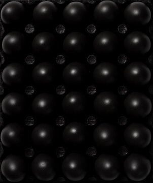 Dark Black Painted Eggs. Flat Lay Abstract Pattern of Food. Top Down View. © marcin jucha