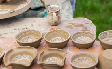pots made of pottery that are left to dry in the sun