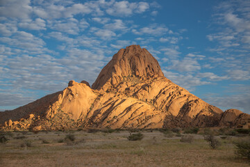 Fototapeta na wymiar Mount Spitzkoppe, formed when part of a giant volcano collapsed, resulting in many interesting and bizarre rock formations