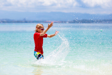 Kids playing on beach. Children play at sea.