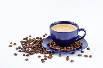 Cup of coffee and coffee beans on a platter on a white background