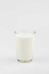 A glass of milk on a white background