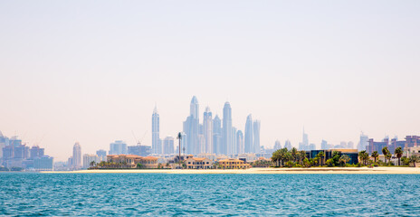 Fototapeta na wymiar Dubai Marina skyscrapers and villas on the Palm Jumeirah. Luxury properties of UAE