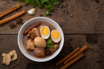 Egg and Pork in Sweet Brown Sauce ,Kai Pa Lo in white bowl.