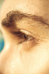 European guy's eye close up. part of the face macro. the eyeball is extremely close. Human pupil © Yuliia