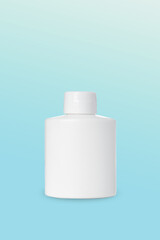 empty white plastic bottle for cosmetics on blue background. Mockup