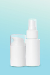 empty white plastic blow and spray bottles for cosmetics on blue background. Mockup