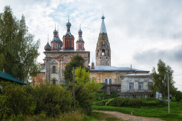 Fototapeta na wymiar Russia, the village Parskoe. The ensemble of the Church of the Beheading of St. John the Baptist and Ascension