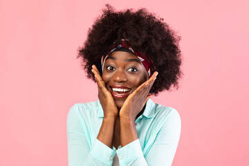 Fototapeta na wymiar Excited African American Bushy Woman Looking At Camera Over Pink Background