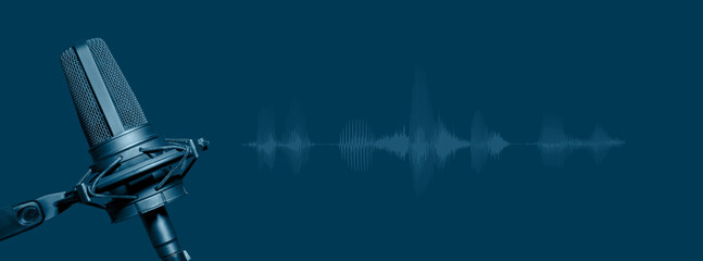 Studio microphone with waveform on blue background, podcasting, radio program or voice recording...