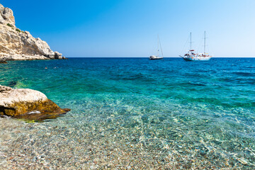 crystal clear water of Traganou Beach on Rhodes island in Greece