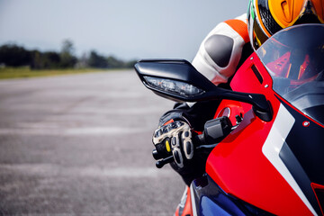 rider motorbike on the road riding with soft-focus and over light in the background