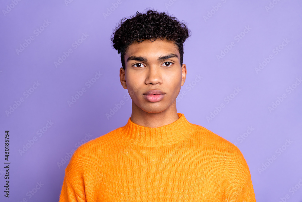 Sticker Photo of serious confident dark skin man wear orange sweater isolated violet color background