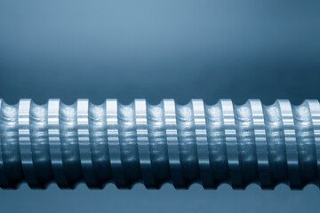 The close-up scene of linear lead ball screw spare part . The hi-precision CNC machine manufacturing concept.