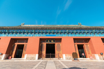 Gate and red wall of the ancient building in Zhaigong Temple against blue sky in Temple of Heaven, Beijing city, China